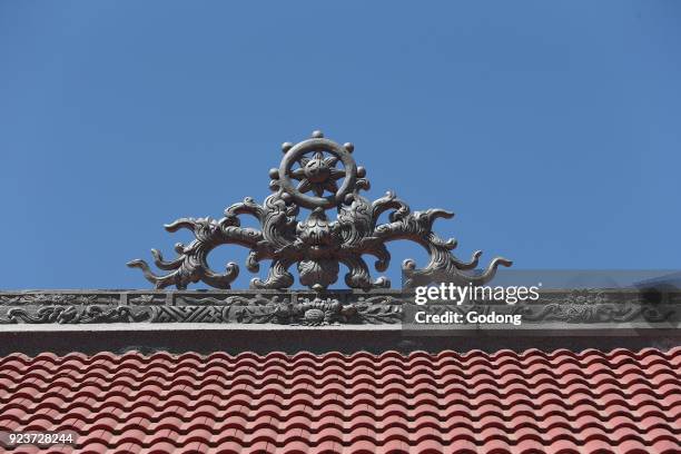 Van Hanh zen buddhist monastery. Dragon with Dharma wheel on top of the roof monastery. Dalat, Vietnam.