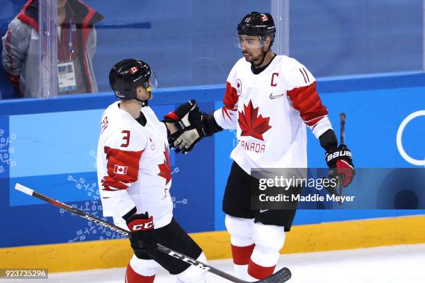 Chris Kelly of Canada celebrates with teammates after scoring in the third period against Czech Republic during the Men's Bronze Medal Game on day...