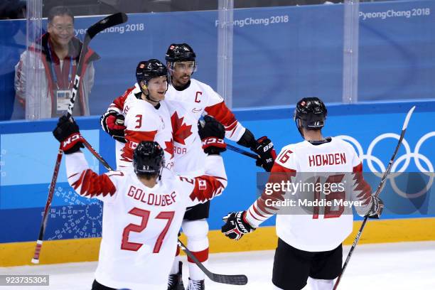 Chris Kelly of Canada celebrates with teammates after scoring in the third period against Czech Republic during the Men's Bronze Medal Game on day...