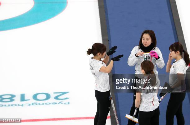 Japanese curlers discuss in the 3rd end during the Curling Womens' bronze Medal match between Great Britain and Japan on day fifteen of the...