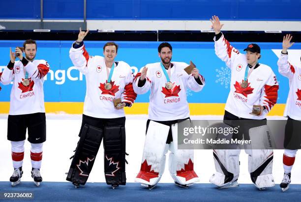 Bronze medal winners Cody Goloubef, Ben Scrivens, Kevin Poulin and Justin Peters of Canada celebrate after defeating Czech Republic 6-4 during the...