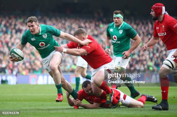 Chris Farrell of Ireland breaks from the tackle of Samson Lee of Wales during the NatWest Six Nations match between Ireland and Wales at Aviva...