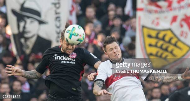 Stuttgart's German forward Daniel Ginczek and Frankfurt's German defender Marco Russ vie for the ball during the German first division Bundesliga...