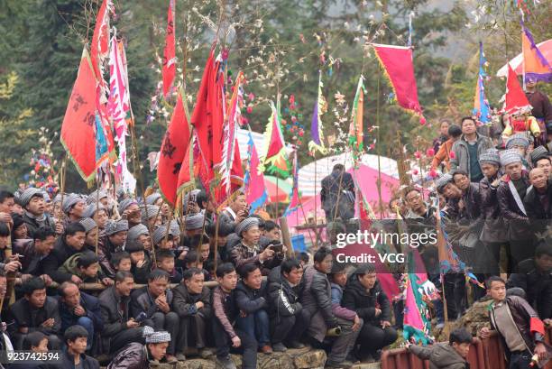Villagers watch bulls fight against each other during a competition at Congjiang County on February 24, 2018 in Qiandongnan Miao and Dong Autonomous...