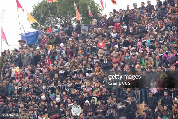 Villagers watch bulls fight against each other during a competition at Congjiang County on February 24, 2018 in Qiandongnan Miao and Dong Autonomous...