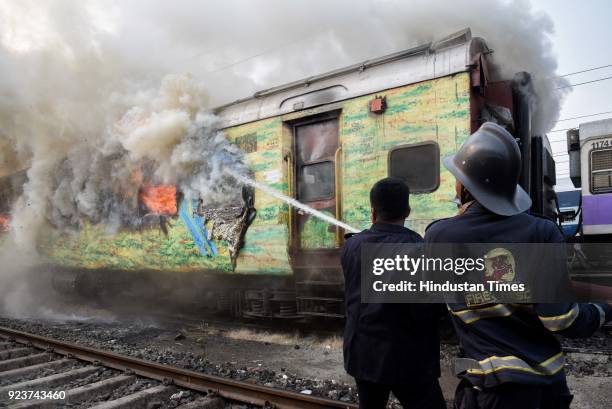 Fire broke out in an empty coach of Pune-New Delhi Duronto Express parked at the yard near Sangam Park, on February 23, 2018 in Pune, India. Fire...