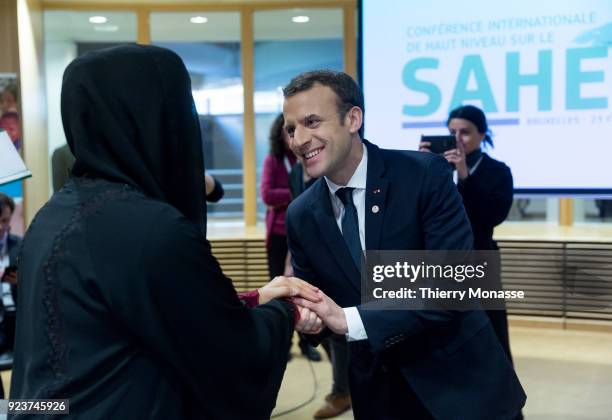 French President Emmanuel Macron is greeting a counterpart during a round table meeting of the EU-Sahel at EU Commission headquarters in Brussels on...