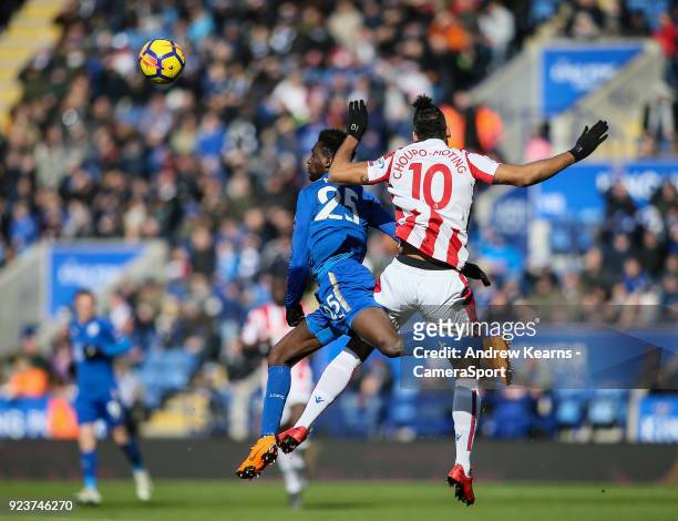 Leicester City's Wilfred Ndidi competing in the air with Stoke City's Eric Maxim Choupo-Moting during the Premier League match between Leicester City...
