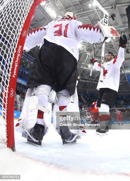 Bronze medal winner Kevin Poulin of Canada celebrates with teammates after defeating Czech Republic 6-4 during the Men's Bronze Medal Game on day...
