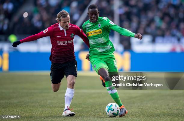 Iver Fossum of Hannover 96 and Denis Zakaria of Borussia Moenchengladbach battle for the ball during the Bundesliga match between Hannover 96 and...