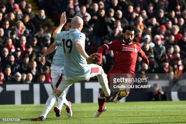 Liverpool's Egyptian midfielder Mohamed Salah vies with West Ham United's Welsh defender James Collins during the English Premier League football...