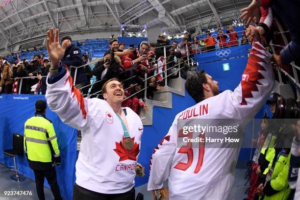 Ben Scrivens and Kevin Poulin of Canada celebrate with fans after defeating Czech Republic 6-4 during the Men's Bronze Medal Game on day fifteen of...