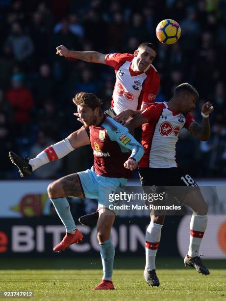 Oriol Romeu and Mario Lemina of Southampton battle for the header with Jeff Hendrick of Burnley during the Premier League match between Burnley and...
