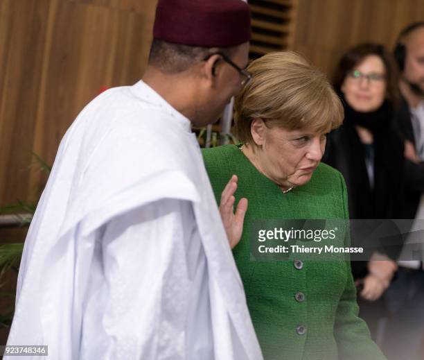 President of Niger Mahamadou Issoufou the German Chancellor Angela Merkel are walking at the end of the EU-Sahel at EU Commission headquarters in...