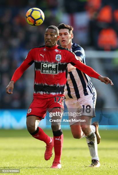 Gareth Barry of West Bromwich Albion challenges Rajiv van La Parra of Huddersfield Town during the Premier League match between West Bromwich Albion...