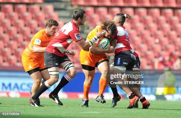 Lions' Franco Mostert and Howard Mnisi tackle Jaguares' Bautista Ezcurra during the SUPERXV Rugby match between Lions and Jaguares at Ellis Park...