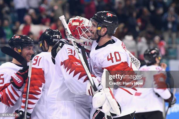 Bronze medal winners Kevin Poulin and Maxim Lapierre of Canada celebrate after defeating Czech Republic 6-4 during the Men's Bronze Medal Game on day...