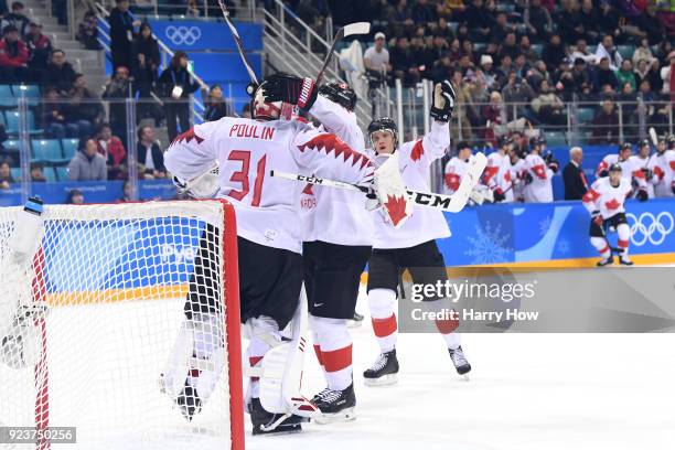 Bronze medal winner Kevin Poulin of Canada celebrates with teammates after defeating Czech Republic 6-4 during the Men's Bronze Medal Game on day...