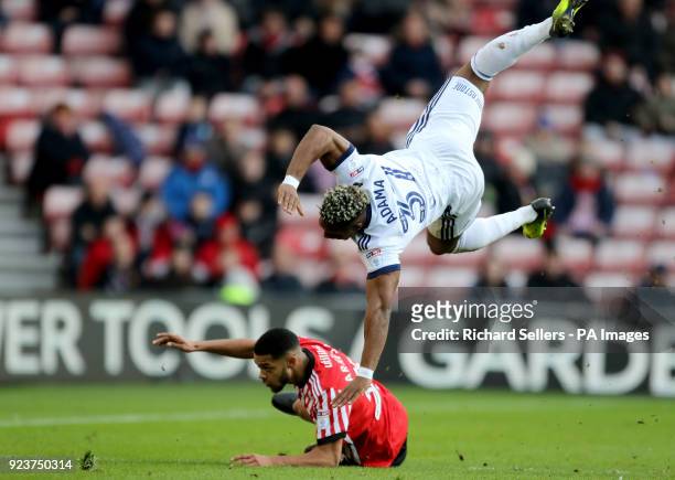 Sunderland's Jake Clarke-Salter tackles Middlesbrough's Adama Traore for which he receives a red card during the Championship match at the Stadium of...
