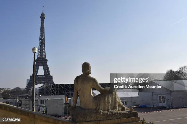 View of the Eiffel Tower as construction of the Yves Saint-Laurent venue prior to their show during Paris Fashion Week on February 24, 2018 in Paris,...