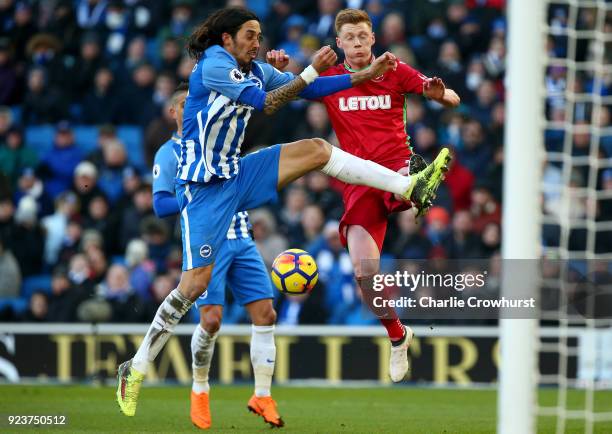 Matias Ezequiel Schelotto of Brighton and Hove Albion competes for the ball with Samuel Clucas of Swansea City during the Premier League match...