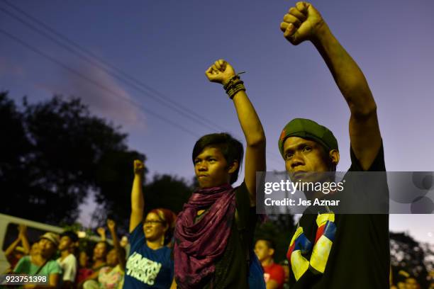 Protesters march during the 32nd annual commemoration of the EDSA People Power uprising on February 24, 2018 in Manila, Philippines. The protester...