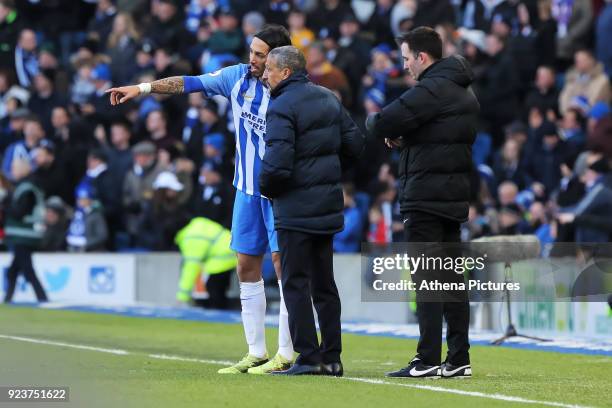 Ezequiel Schelotto of Brighton speaks with Brighton manager Chris Hughton during the Premier League match between Brighton and Hove Albion and...