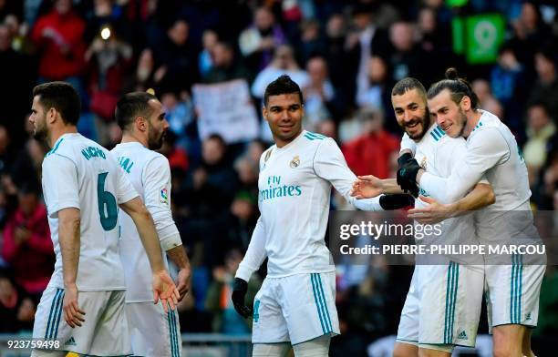 Real Madrid's Welsh forward Gareth Bale celebrates with Real Madrid's French forward Karim Benzema after scoring during the Spanish league football...