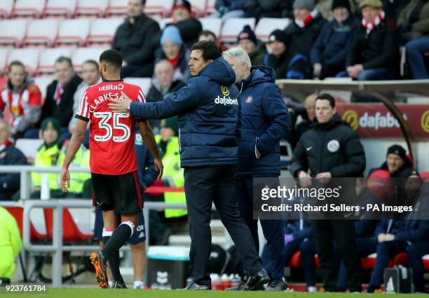 Sunderland manager Chris Coleman consoles Sunderland's Jake Clarke-Salter after he is shown red card during the Championship match at the Stadium of...
