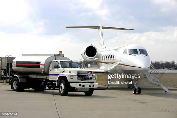 refueling corporate jet - fossil fuel stock pictures, royalty-free photos & images