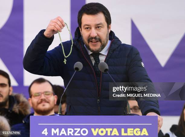 Lega Nord far right party leader Matteo Salvini holds a rosary during campaign rally on Piazza Duomo in Milan on February 24 a week ahead of the...