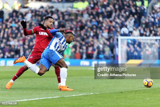 Martin Olsson of Swansea City challenges Jose Izquierdo of Brighton during the Premier League match between Brighton and Hove Albion and Swansea City...