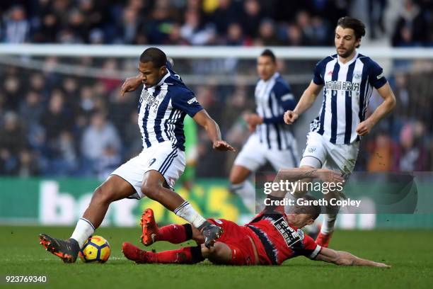 Jonathan Hogg of Huddersfield Town tackles Jose Salomon Rondon of West Bromwich Albion during the Premier League match between West Bromwich Albion...