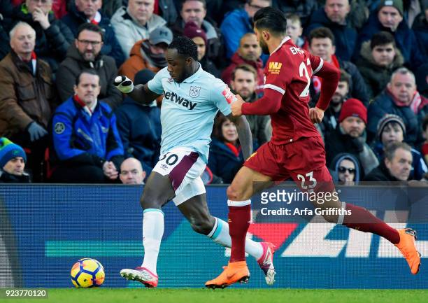 Michail Antonio of West Ham United in action with Emre Can of Liverpool during the Premier League match between Liverpool and West Ham United at...