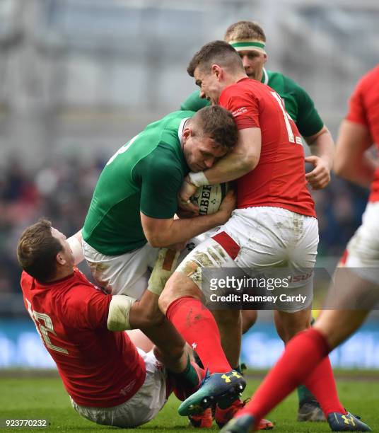 Dublin , Ireland - 24 February 2018; Chris Farrell of Ireland is tackled by Hadleigh Parkes, left, and Scott Williams of Walesduring the NatWest Six...