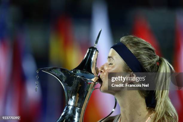 Elina Svitolina of Ukraine celebrates after vinning the WTA Dubai Duty Free Tennis Championship at the Dubai Duty Free Stadium on February 24, 2018...