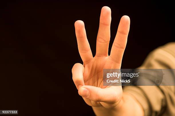 hand counting (three) - three stock pictures, royalty-free photos & images