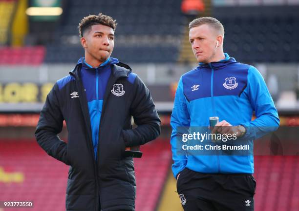 Mason Holgate and Jordan Pickford of Everton arrive ahead of the Premier League match between Watford and Everton at Vicarage Road on February 24,...