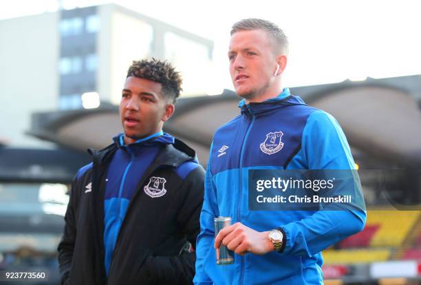 Mason Holgate and Jordan Pickford of Everton arrive ahead of the Premier League match between Watford and Everton at Vicarage Road on February 24,...