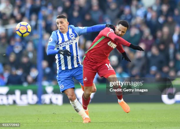 Anthony Knockaert of Brighton and Hove Albion and Martin Olsson of Swansea City battle for the ball during the Premier League match between Brighton...
