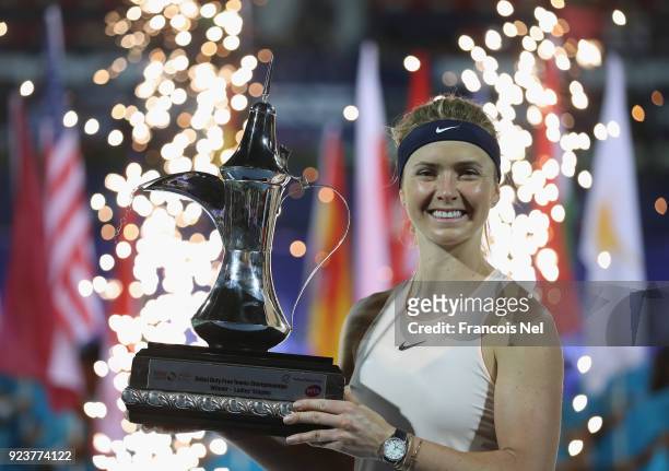Elina Svitolina of Ukraine poses with the trophy after winning the WTA Dubai Duty Free Tennis Championship at the Dubai Duty Free Stadium on February...