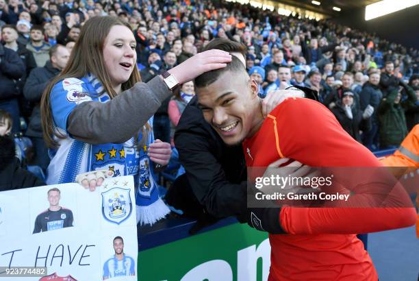 Collin Quaner of Huddersfield Town celebrates with fans after the Premier League match between West Bromwich Albion and Huddersfield Town at The...