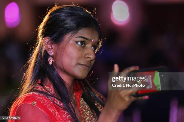 Tamil girl records a video on her mobile phone as Super Singer Jessica Judes performs in Toronto, Ontario, Canada, on February 19, 2018. Canadian...