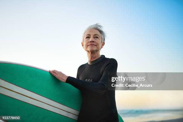 go where the waves are - surfer stock pictures, royalty-free photos & images