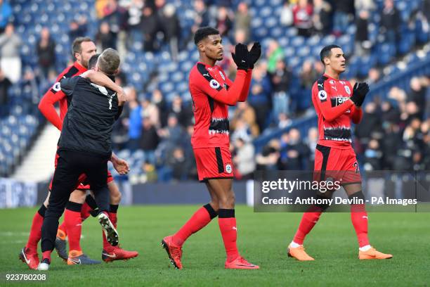 Huddersfield players celebrate at the final whistle during the Premier League match at The Hawthorns, West Bromwich.