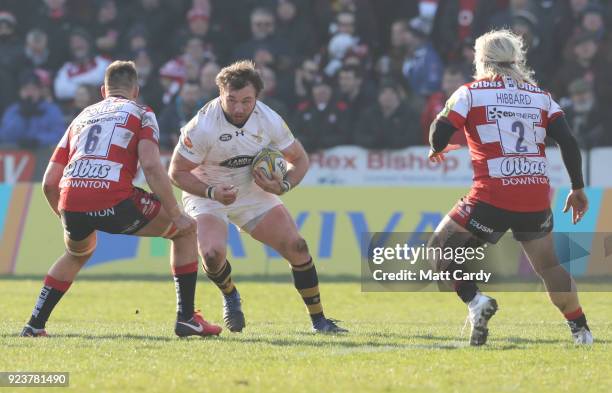 Matt Mullan of Wasps tries to pass Jake Polledri and Richard Hibbard of Gloucester during the Aviva Premiership match between Gloucester Rugby and...