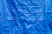 Wrinkled blue tarp texture full frame background