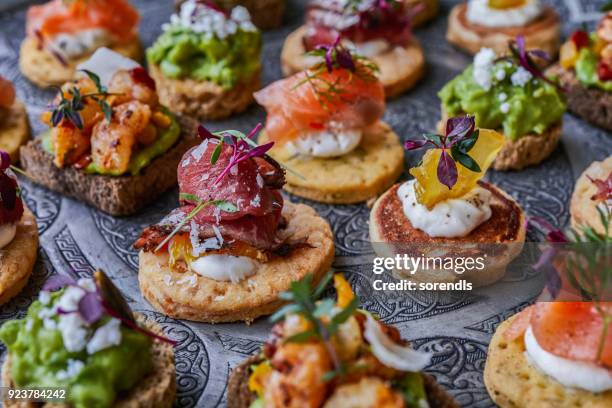 canapes for party - canapes stock pictures, royalty-free photos & images