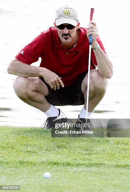 Texas Rangers pitching coach Mike Maddux lines up his putt during the 2009 Maddux Harmon Celebrity Invitational at the Spanish Trail Golf and Country...