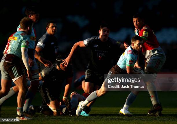 Dave Lewis of the Harlequins runs with the ball during the Aviva Premiership match between Harlequins and Newcastle Falcons at Twickenham Stoop on...